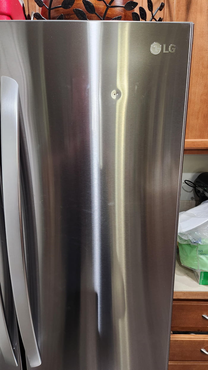Damage to new fridge by delivery guys. Happened in the last 20 seconds